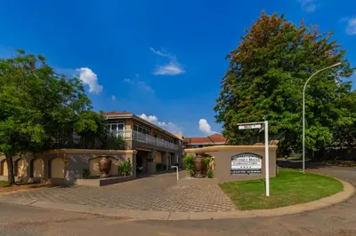 a street sign in front of a building at Lakeview Boutique Hotel & Conference Center in Benoni