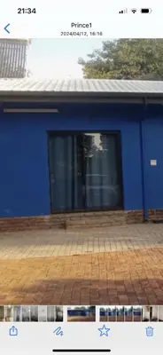 a picture of a blue building with a window at Blue Haven Guesthouse in Polokwane