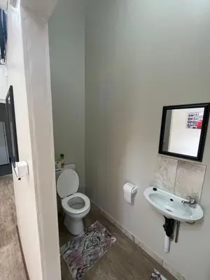 a bathroom with a toilet and a sink at Blue Haven Guesthouse in Polokwane