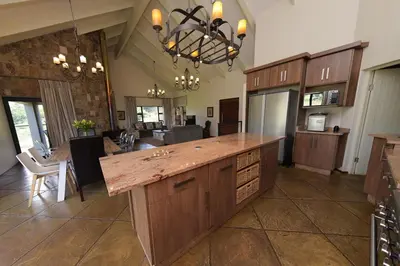 a large kitchen with a large island in a room at Walkersons Riverview in Dullstroom