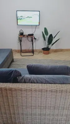 a living room with two pillows and a screen at NEMARA Self Catering Lodge in Polokwane