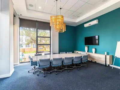 a conference room with a long table and chairs at 1368 The Blyde Crystal Clear 1 Bedroom Apartment in Pretoria