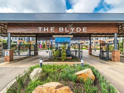 a building with a sign that reads the blible at 5 The Blyde Crystal Clear 2 Bedroom Apartment in Pretoria