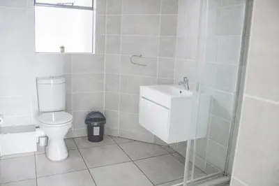 a bathroom with a toilet and a sink at 5 The Blyde Crystal Clear 2 Bedroom Apartment in Pretoria