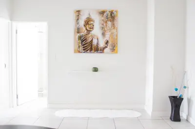 a white bathroom with a painting on the wall at 507 The Blyde Crystal Clear Lagoon 2 Bedroom Apartment in Pretoria