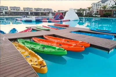 a group of kayaks on a dock in the water at 11 The Blyde Crystal Clear Lagoon 2 Bedroom Garden Apartment in Pretoria