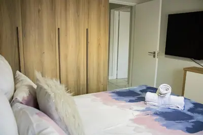 a bedroom with a bed with a towel on it at 1517 The Blyde Crystal Clear 3 Bedroom Garden Beachfront in Pretoria
