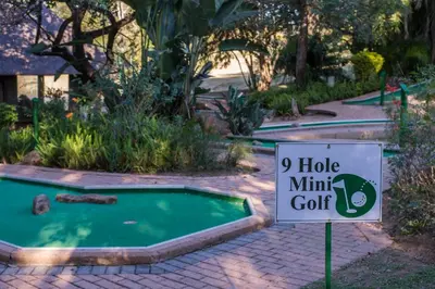 a sign in front of a mini golf course at Kruger Park Lodge Unit No. 209 in Hazyview