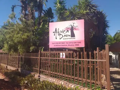a sign for an african dance championship on a fence at Africa Dawn Guesthouse in Musina
