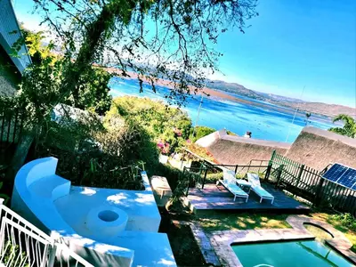 a view of the beach from a house with a swimming pool at ScenicViews@103 in Hartbeespoort