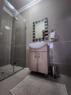 a bathroom with a sink and a mirror at ScenicViews@103 in Hartbeespoort