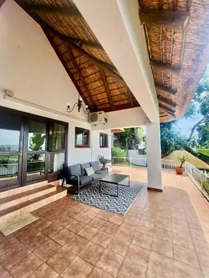 an outdoor patio with a couch and a table at ScenicViews@103 in Hartbeespoort