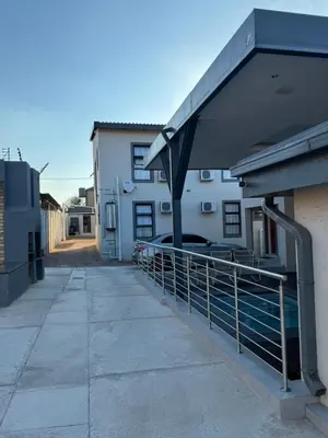 a building with an awning on the side of it at 801 Guesthouse in Springs