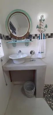 a bathroom with a sink and a mirror at Cozy Guest in Graskop