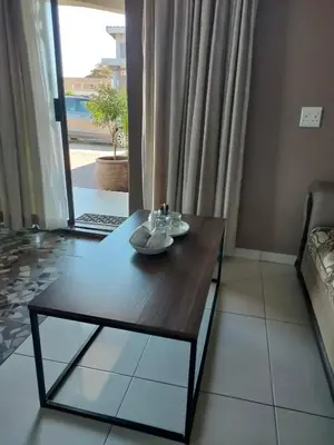 a table with two dishes on it in front of a window at Soma Guesthouse in Groblersdal