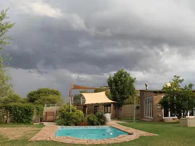 a house with a swimming pool in the yard at 46 Welgevonden in Dinokeng in Dinokeng Game Reserve