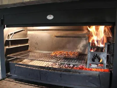 a grill with a bunch of food cooking in it at 46 Welgevonden in Dinokeng in Dinokeng Game Reserve