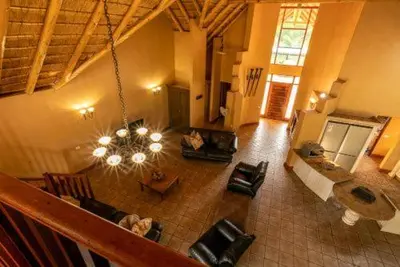 an overhead view of a living room with a chandelier at 23 Zebula - 4 Bedroom 14 Sleeper Home in Mabula