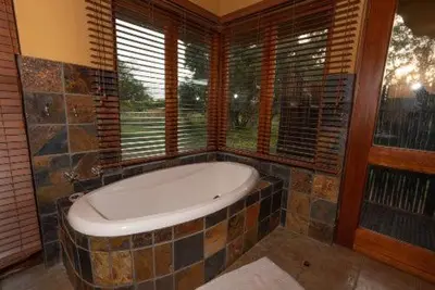 a bath tub in a room with a window at 23 Zebula - 4 Bedroom 14 Sleeper Home in Mabula