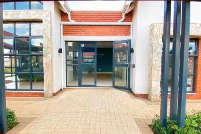 an entrance to a building with a blue door at Luxury 1bed Serengeti OliveWood ORT Airport in Kempton Park