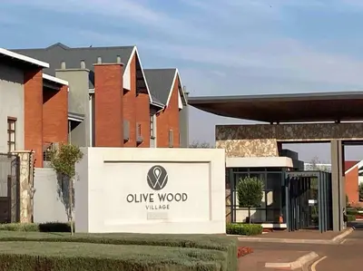 a sign in front of a building at Luxury 1bed Serengeti OliveWood ORT Airport in Kempton Park