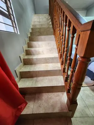 a staircase with wooden railings and a stair case at Mountain Vue in Hartbeespoort