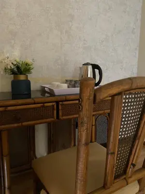 a tea kettle sitting on top of a wooden table at Siena Sun Guesthouse Rooms and Breakfast Option in Midrand