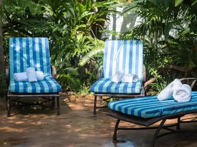 two blue chairs with teddy bears on them at Aanmani Rose Guesthouse in Pretoria