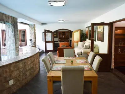 a dining room with a table and chairs at Aanmani Rose Guesthouse in Pretoria