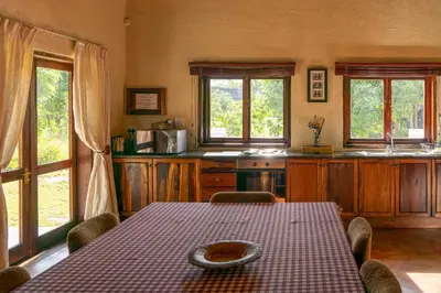 a kitchen with a table with a plate on it at Impisi Accommodation in Phalaborwa