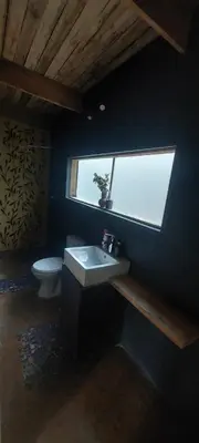 a bathroom with a sink and a toilet at Hartbeest Bush Stay #3 in Hartbeespoort