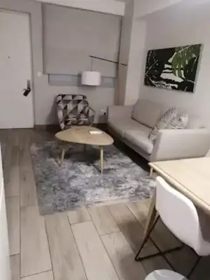 a living room with a couch and a table at Premier Lifestyle at The Regency in Pretoria