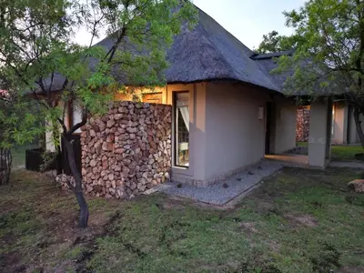 a house made out of a stone wall at 203 Zebula - 5 Bedroom 20 sleeper in Mabula