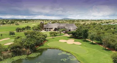 an aerial view of a golf course with a house at 203 Zebula - 5 Bedroom 20 sleeper in Mabula