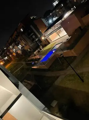 a view of a living room at night at The Waterfallcity Charm next to Mall of Africa in Midrand