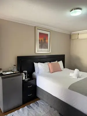a hotel room with two beds at The Eden Boulders Hotel and Resort Midrand in Midrand