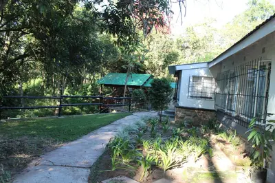 a house with a gazebo in a yard at Bush Lilly Cottage in Hazyview