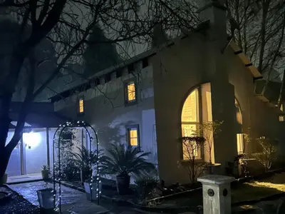 a house at night with lights on at Highland Rose Country House Spa in Dullstroom