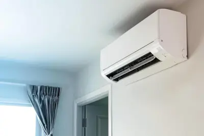 a bathroom with a air conditioner hanging on a wall at Muofhe Graceland Lodge in Thohoyandou