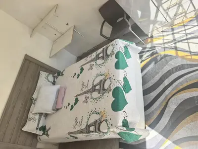 a bedroom with a bed with a pillow and a mural at Karee Gardens B&B in Springs