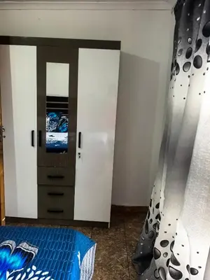 a bedroom with a bed and a tv on a wall at Karee Gardens B&B in Springs