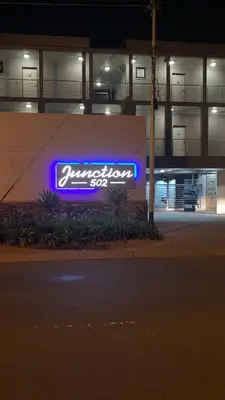 a neon sign on the side of a building at CALDESMO Private Apartment in Pretoria