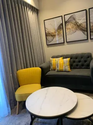 a living room with a couch and a table at Entire Studio Apartment at The Capital Triology in Pretoria