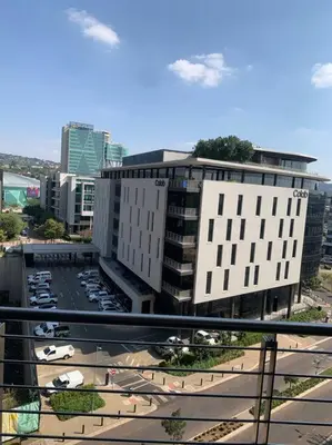a view of a city with buildings and a parking lot at Entire Studio Apartment at The Capital Triology in Pretoria
