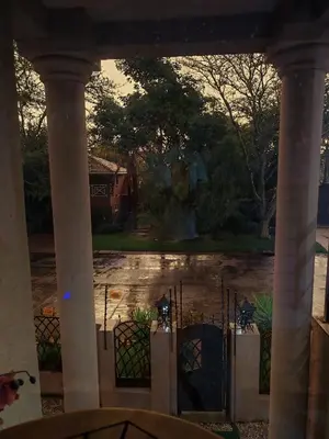 a view from a porch with a gate and a yard at Lady D Exclusive Abode in Polokwane