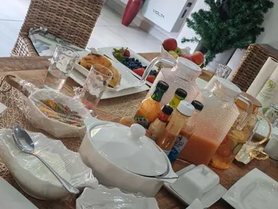 a table with a bunch of food and bottles on it at Lady D Exclusive Abode in Polokwane