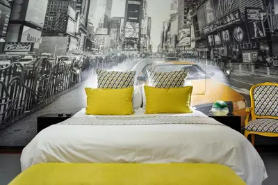 a bedroom with a large bed with yellow pillows at Yalla Yalla Boutique Hotel in Witbank