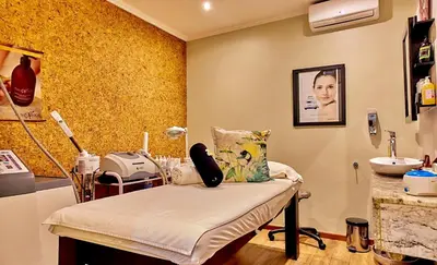 a hospital room with a bed and a sink at Sanbonani Hotel in Hazyview