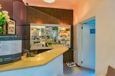 a pharmacy with a display case in a store at Sanbonani Hotel in Hazyview