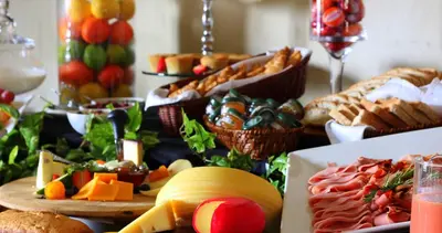 a table topped with lots of different types of food at La Villa Vita in Nelspruit